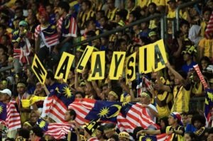 Ilustrasi Suporter Malaysia. (Bolasport.com)