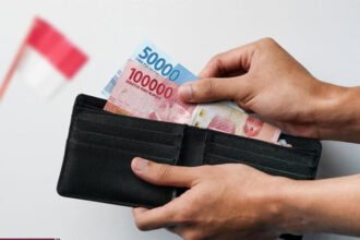 BI kembali memangkas suku bunga acuan ke 5%, rupiah ditutup melemah tipis ke Rp16.271 per dolar AS.