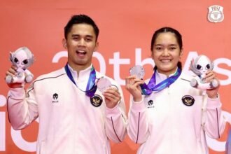 Amri Syahnawi/Nita Violina Marwah meraih medali perak Asian Games 2026 setelah kalah dari Jiang Zhen Bang/Wei Yaxin di final.